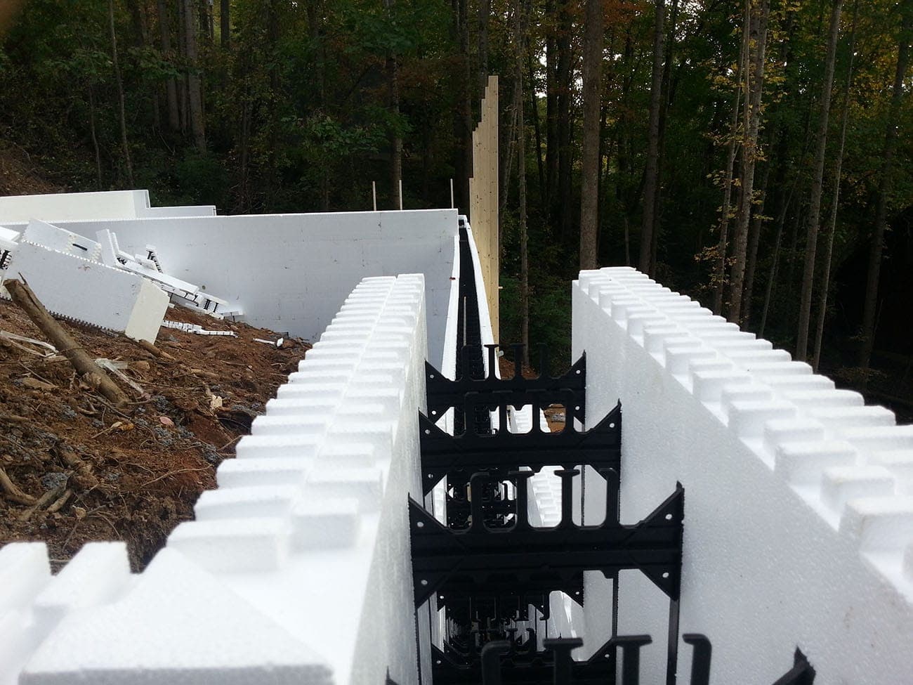 ICF wall construction with insulated forms and rebar